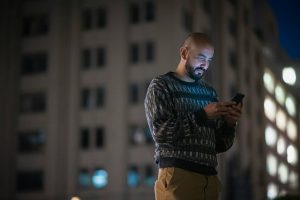 u-s-catholic-man-using-smartphone