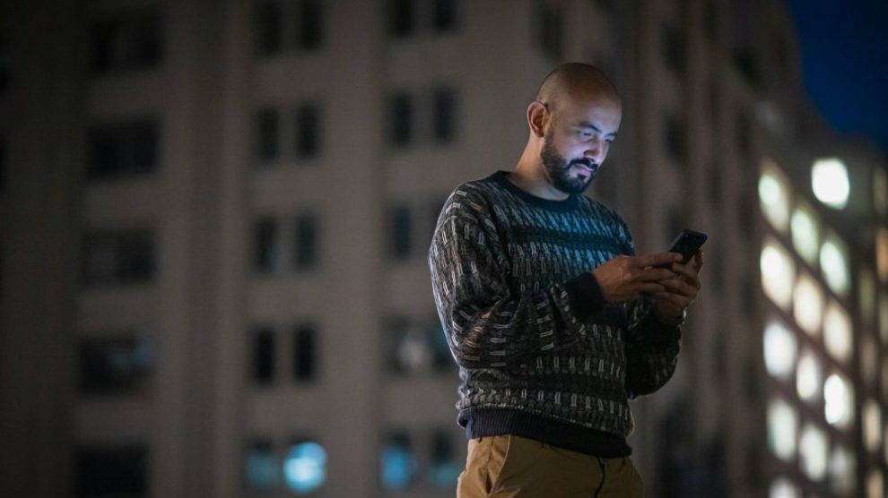 u-s-catholic-man-using-smartphone
