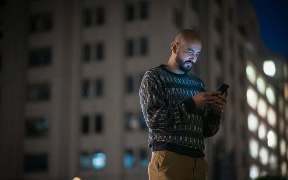 u-s-catholic-man-using-smartphone
