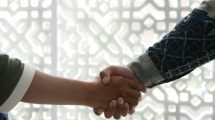 u-s-catholic-two-people-shaking-hands