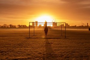 u-s-catholic-silhouette-before-bright-orange-sky
