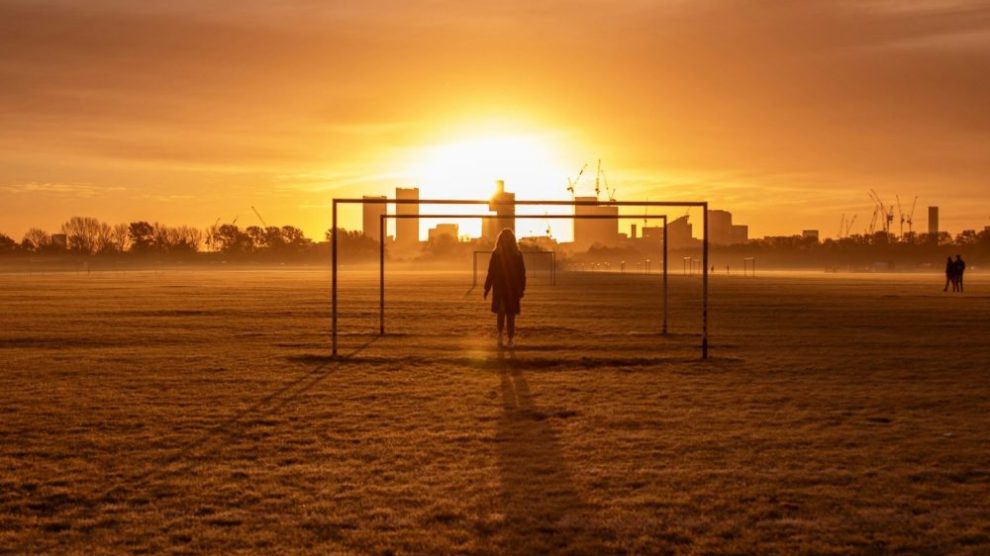 u-s-catholic-silhouette-before-bright-orange-sky