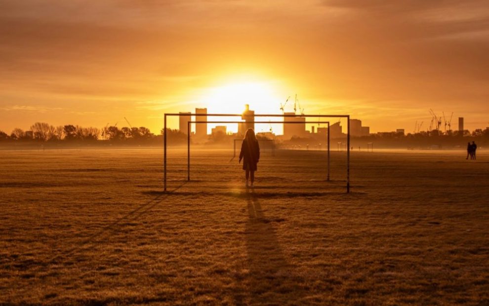 u-s-catholic-silhouette-before-bright-orange-sky