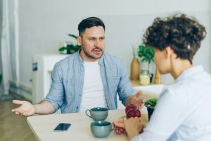 u-s-catholic-annoyed-man-at-table