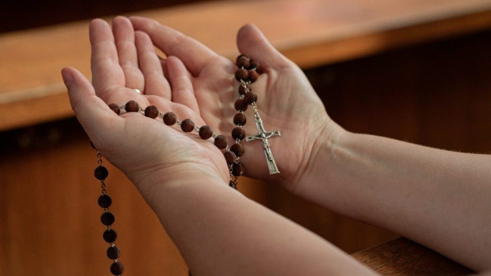 u-s-catholic-person-holding-rosary
