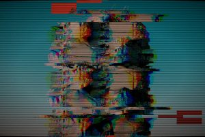Distorted heads on a glitchy television screen