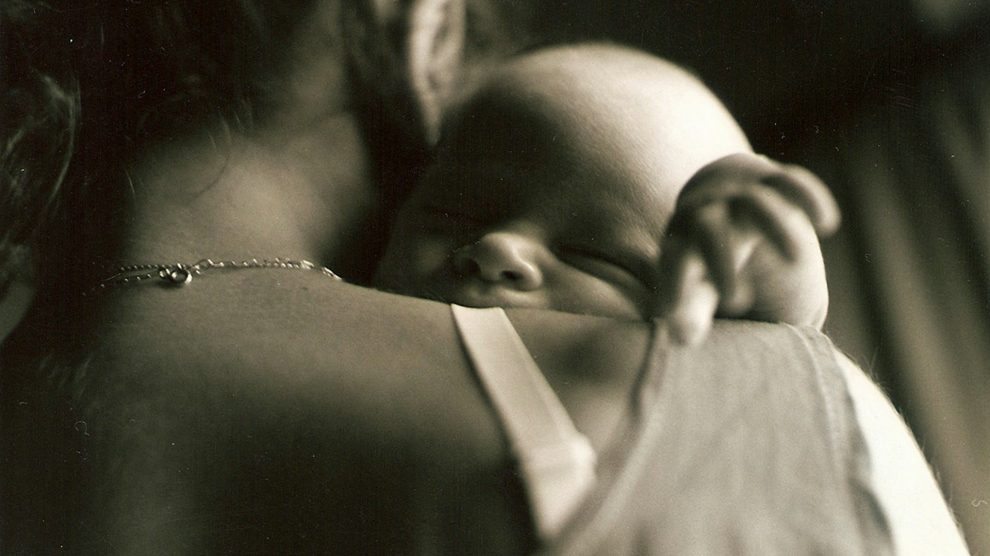Mother Holding Newborn - US Catholic - Images