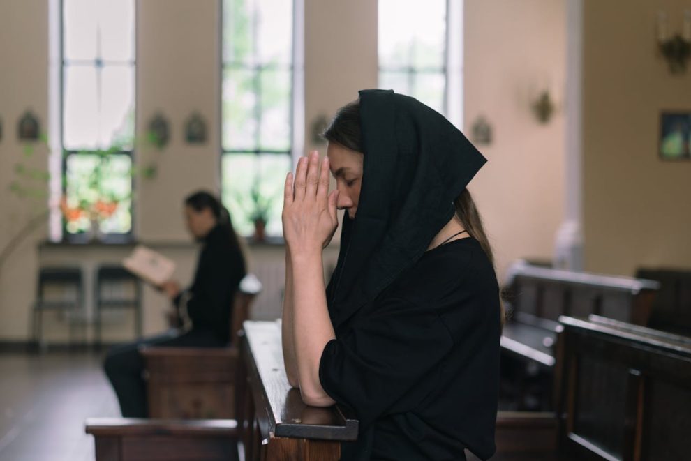 A woman wearing a veil in church