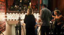 People gathered outside a comedy club