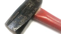 Hammer carved with scripture used for Ploughshares action