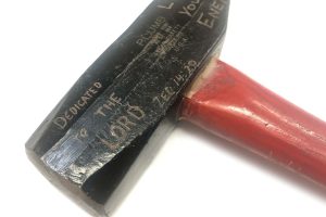 Hammer carved with scripture used for Ploughshares action