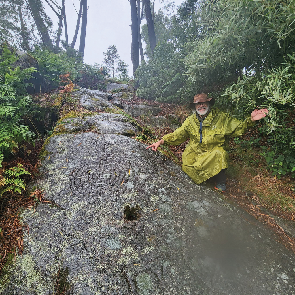 Kenneth McIntosh with a neolithic labyrinth in Spain