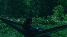 person sitting in a hammock