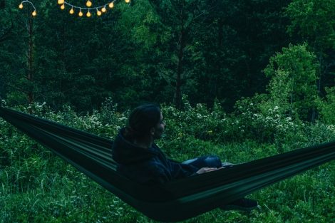 person sitting in a hammock