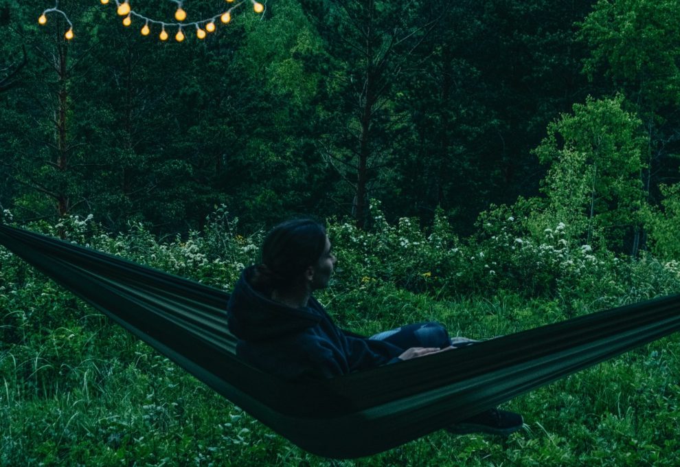 person sitting in a hammock