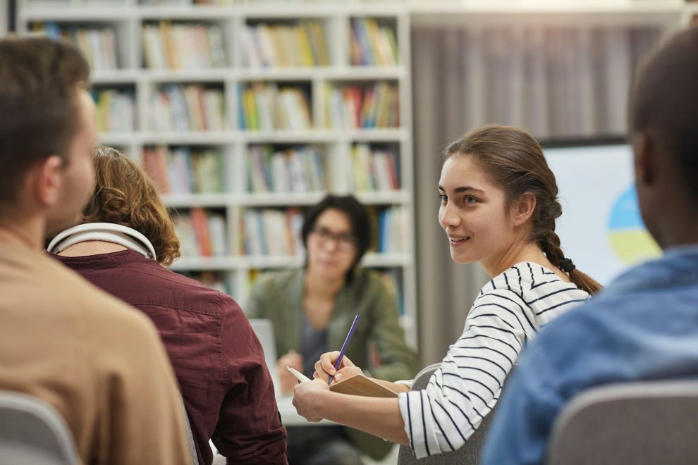 People talking in a classroom