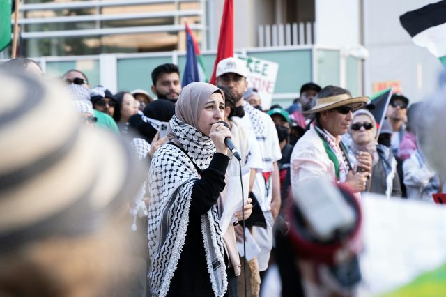 woman speaking at pro-Palestine protest