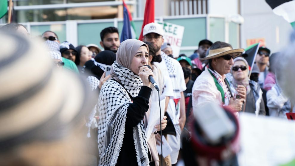 woman speaking at pro-Palestine protest