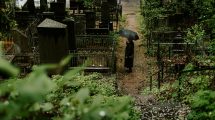 Person standing in a cemetery