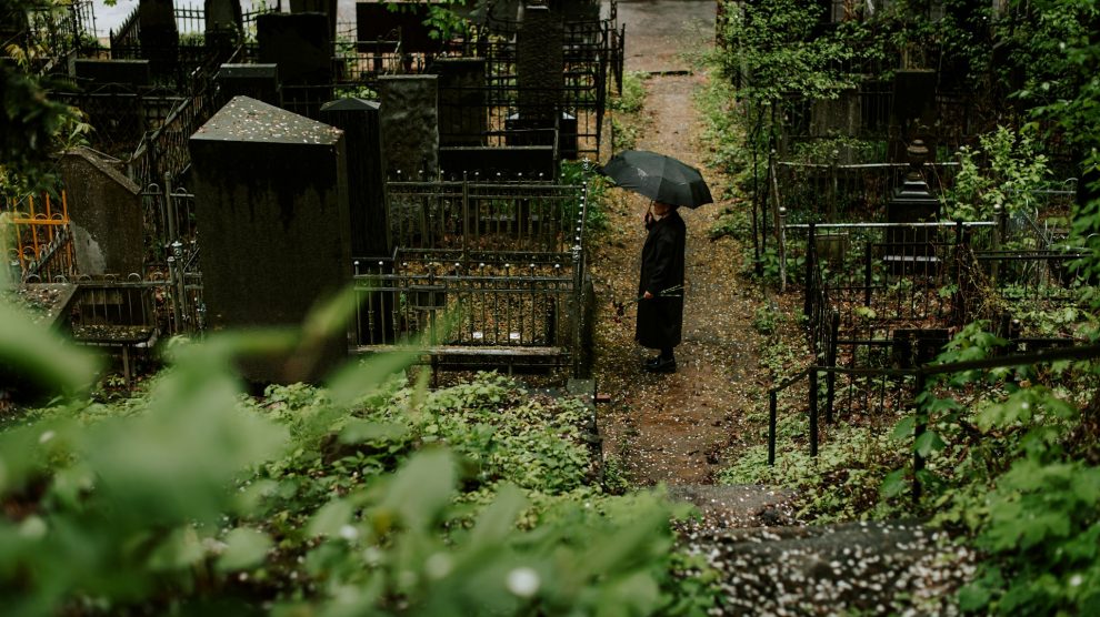 Person standing in a cemetery