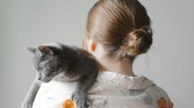 woman holding a cat