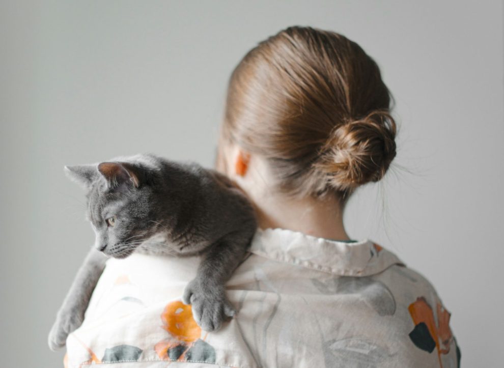 woman holding a cat