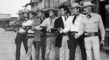 Line of gunslingers in an old western movie