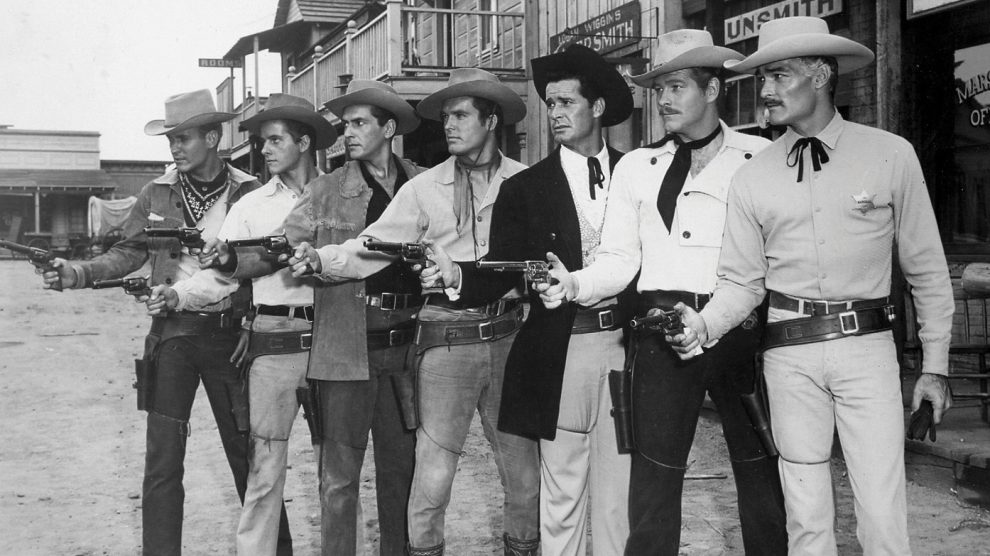 Line of gunslingers in an old western movie