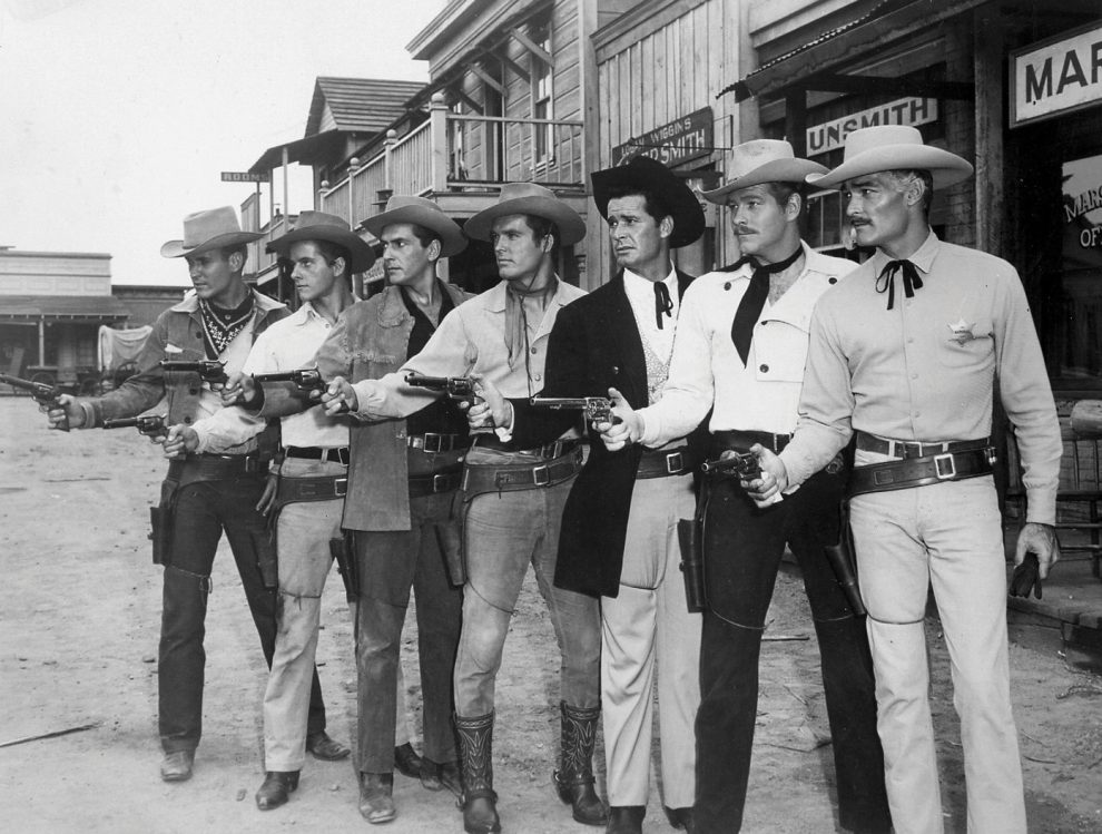 Line of gunslingers in an old western movie