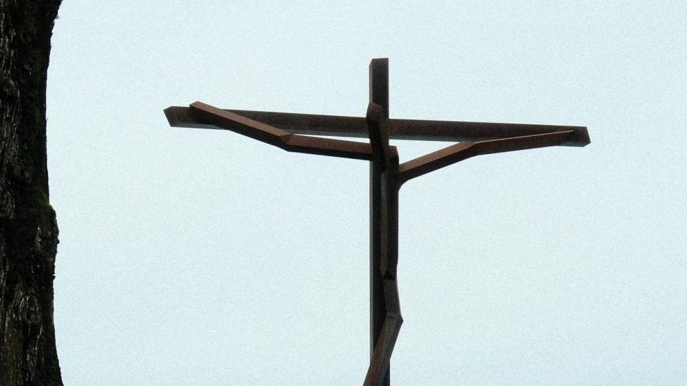 Minimalist sculpture of a crucifix