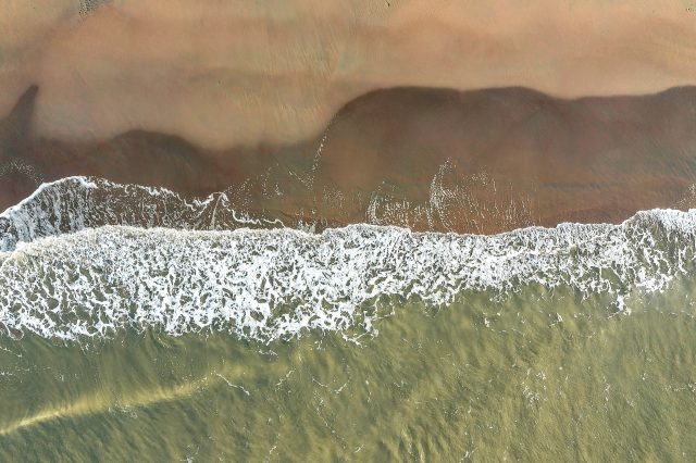 Waves gently crashing on shore