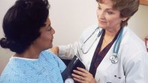 Doctor takes a patient's blood pressure