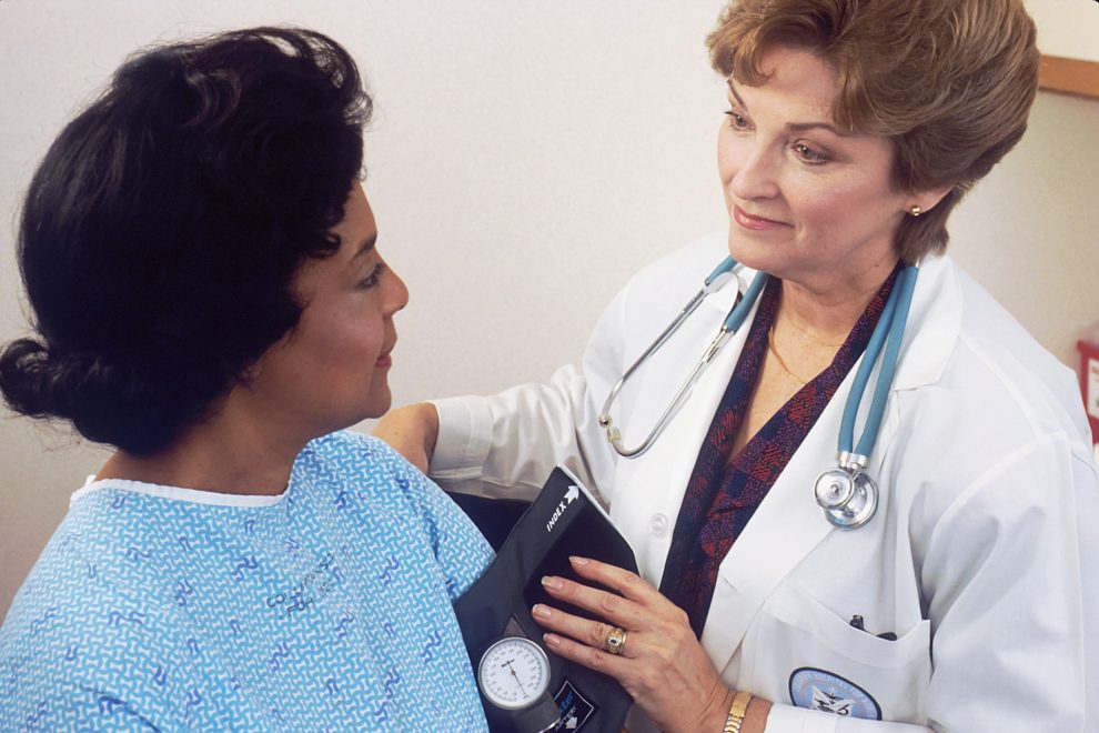 Doctor takes a patient's blood pressure