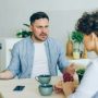 u-s-catholic-annoyed-man-at-table