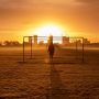 u-s-catholic-silhouette-before-bright-orange-sky