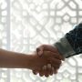 u-s-catholic-two-people-shaking-hands