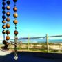 rosary hanging from rearview mirror
