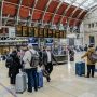 Travelers gathered in airport terminal