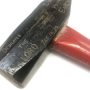 Hammer carved with scripture used for Ploughshares action