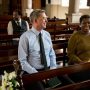 People talking in pews