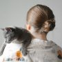 woman holding a cat