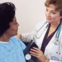 Doctor takes a patient's blood pressure