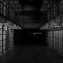 empty-hallway-of-prison-cells