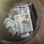 collection-plate-filled-with-cash