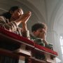 mother-and-son-kneeling-and-praying-in-church