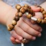 hands-holding-a-rosary