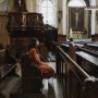 woman-sitting-alone-in-pews