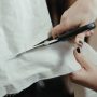 cutting-through-cloth-with-scissors