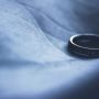 lone-wedding-ring-on-dark-background