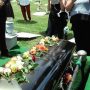 laying-flowers-on-casket-at-a-catholic-funeral